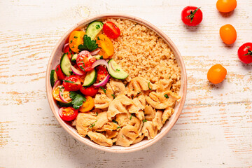 Bowl of quinoa with vegan soy meat and vegetables.