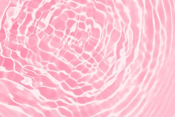 Abstract clear pink water wave texture or natural ripple background. Shadow of water on sunlight....