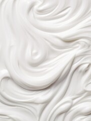 Obraz premium A white cream with a swirl pattern. The cream appears to be a whipped cream, and it has a smooth and creamy texture. The swirl pattern gives the cream a sense of movement
