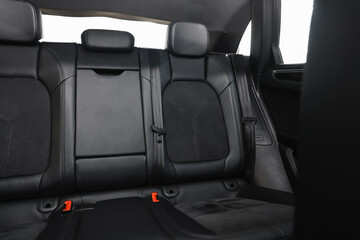 Clean leather seats inside of modern black car