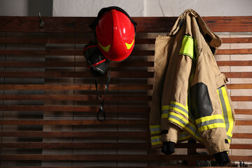 Firefighter`s uniform, helmet and mask at station