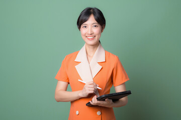 Woman in orange dress with tablet and stylus