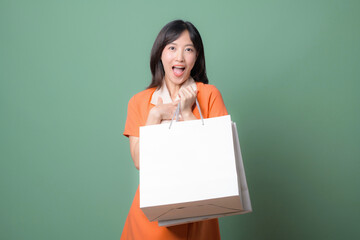 Excited woman holding shopping bag