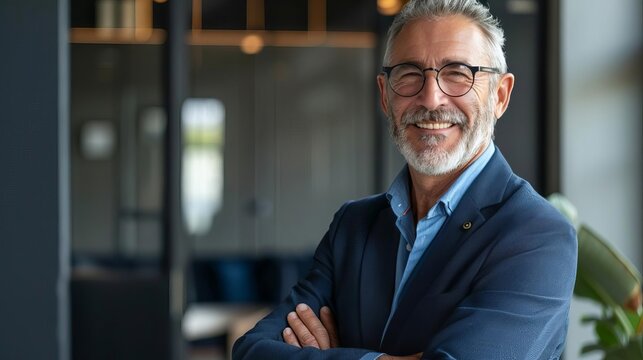 distinguished mature businessman exuding confidence and success posed in modern office setting business