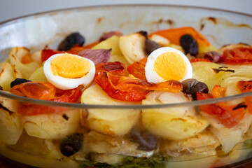 Traditional Portuguese bacalhoada with classic ingredients. When cod Oven