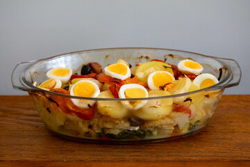 Traditional Portuguese bacalhoada with classic ingredients. When cod Oven
