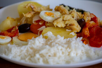 Traditional Portuguese bacalhoada with classic ingredients. When cod Oven