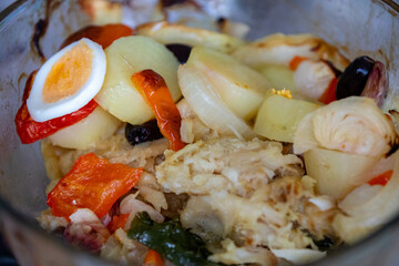 Traditional Portuguese bacalhoada with classic ingredients. When cod Oven