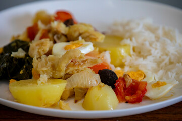 Traditional Portuguese bacalhoada with classic ingredients. When cod Oven