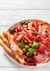 italian antipasto plate of cured meat and veggies