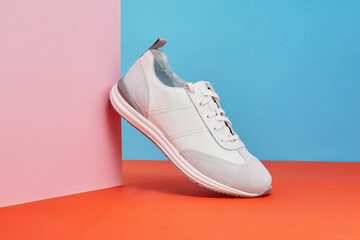 Trendy sneakers shoes isolated on color background. Pair of fashion male sneakers. Summer street style shoes.