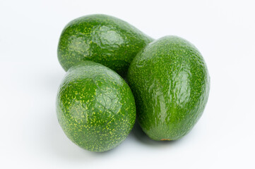 Raw green avocado pile