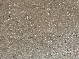 Wet sand texture with small stones