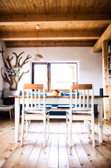 Interior of kitchen in vintage rustic style with wooden furniture in a cottage