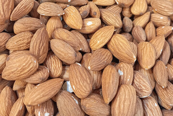 Peeled almond nuts as a background
