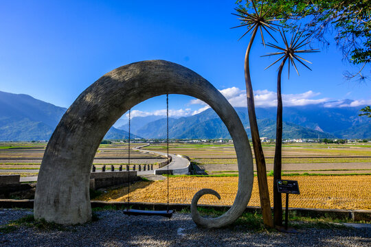 Serene Landscape with Artistic Arch and Swing in Sunny Farmland in Chishang, Taiwan