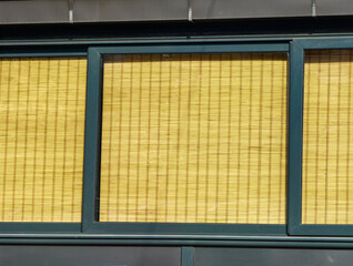 Closed Store. Yellow Curtains and Black Frame Window Edges, Texture and Pattern.