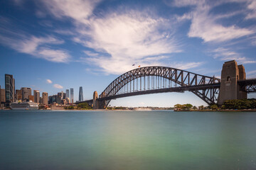 Long exposure of the amazing Sydney Harbour Bridge and Sydney's Downtown from the north bank namely Mattawunga.