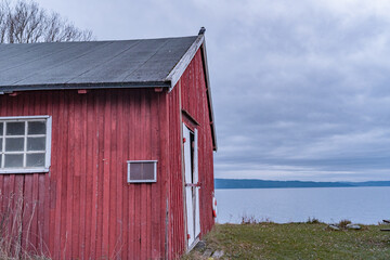 Red cabin with lake view.
