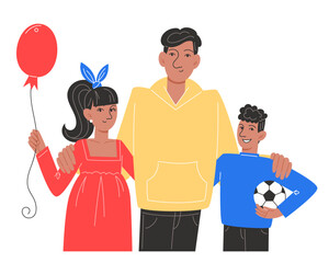 A happy family of father, son and daughter are standing next to each other