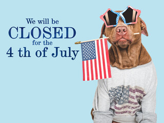 We will be closed for the 4th of July. Signboard and a cute dog. Closeup, indoors. Studio shot....