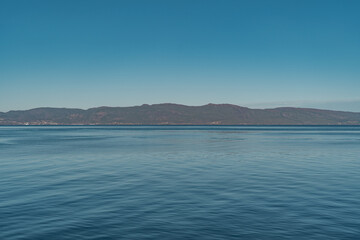 Landscape from sea with hills, rocks and trees. 