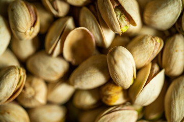 Pistachio nuts. Many pistachios in a pile.