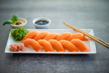Fresh Sushi Roll with salmon.Japanese food. Copyspace black background.