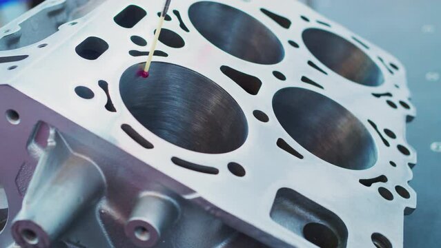 Modern industrial technologies. Metalworking. Coordinate Measuring Machine Using a Ruby Red Torch Probe to Measure Tolerances of Parts in a Manufacturing Facility