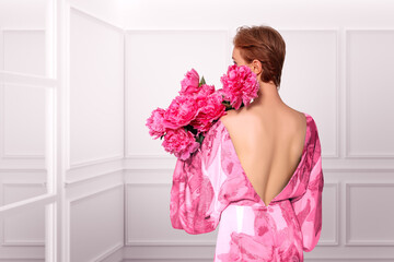 Beauty Blossoming Collage. Composite image woman portrait with Pink Peony Flowers.