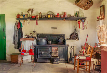 A room with a soild metal range as in the past