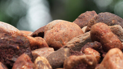 Closeup of piled brown cobblestones