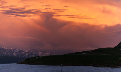 Mountaintop Sunset Over Snow-Capped Peaks