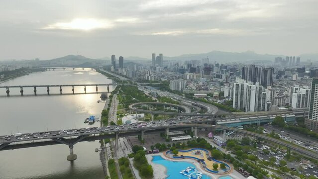 Drone View of Seoul city in South Korea, Ttukseom Island, Han river subway, Summer