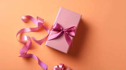 Opened gift box with ribbon and phone on color back