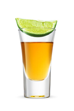 Golden tequila shot with green lime wedge on isolated. Transparent PNG image.