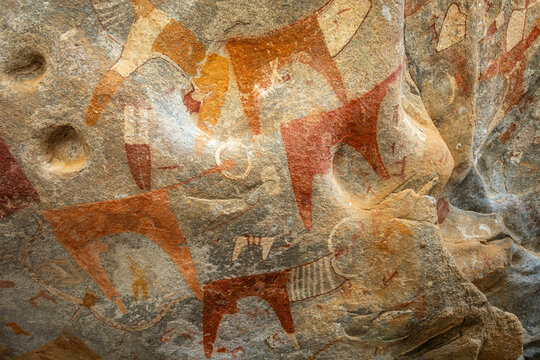 Ancient tribal rock artwork primitive carvings of cattle and hunters, Laas Geel, Maroodi Jeex, Hargeisa, Somaliland