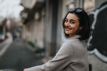 Fototapeta premium Fashionable teenage girl enjoying autumn day in urban setting.