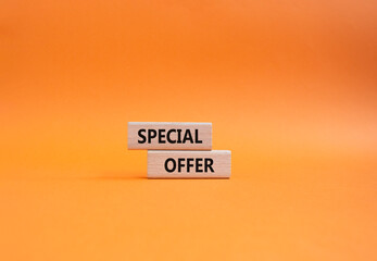 Special offer symbol. Concept word Special offer on wooden blocks. Beautiful orange background....