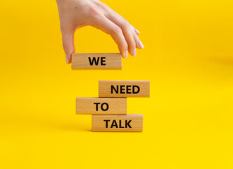 We need to talk symbol. Concept words We need to talk on wooden blocks. Beautiful yellow...