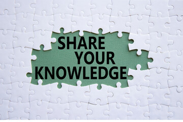 Share your knowledge symbol. Concept word Share your knowledge on white puzzle. Beautiful grey...