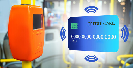 Validator for accepting payments on bus. Payment for travel by credit card. Accept payments on bus using NFC. Credit card for non-cash payments. Orange validator near blurred bus. Public transport