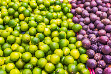 Close-up view of produce shelves with lime and passion fruit in the grocery section of a supermarket. Sweden.