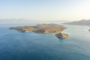 Aerial view by drone of idyllic seascape with small mediterranean island.