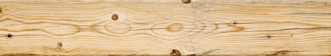 Natural wood grain unfinished wooden board with knots and rough texture