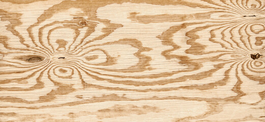 Sheet of plywood with wood grain in wavy lines pattern