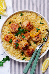 Baked lemon butter chicken meatballs with creamy orzo.top veiw