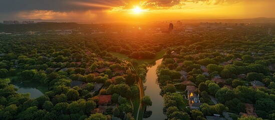 Aerial view of a suburban area with lush greenery at sunset