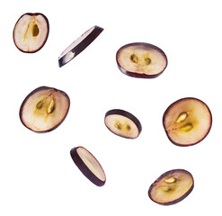 Fresh organic Blue Grape falling in the air isolated on white background. Food levitation or zero gravity conception.