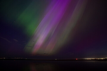 Northern lights / aurora over Dublin Bay in Ireland after G5 solar storm